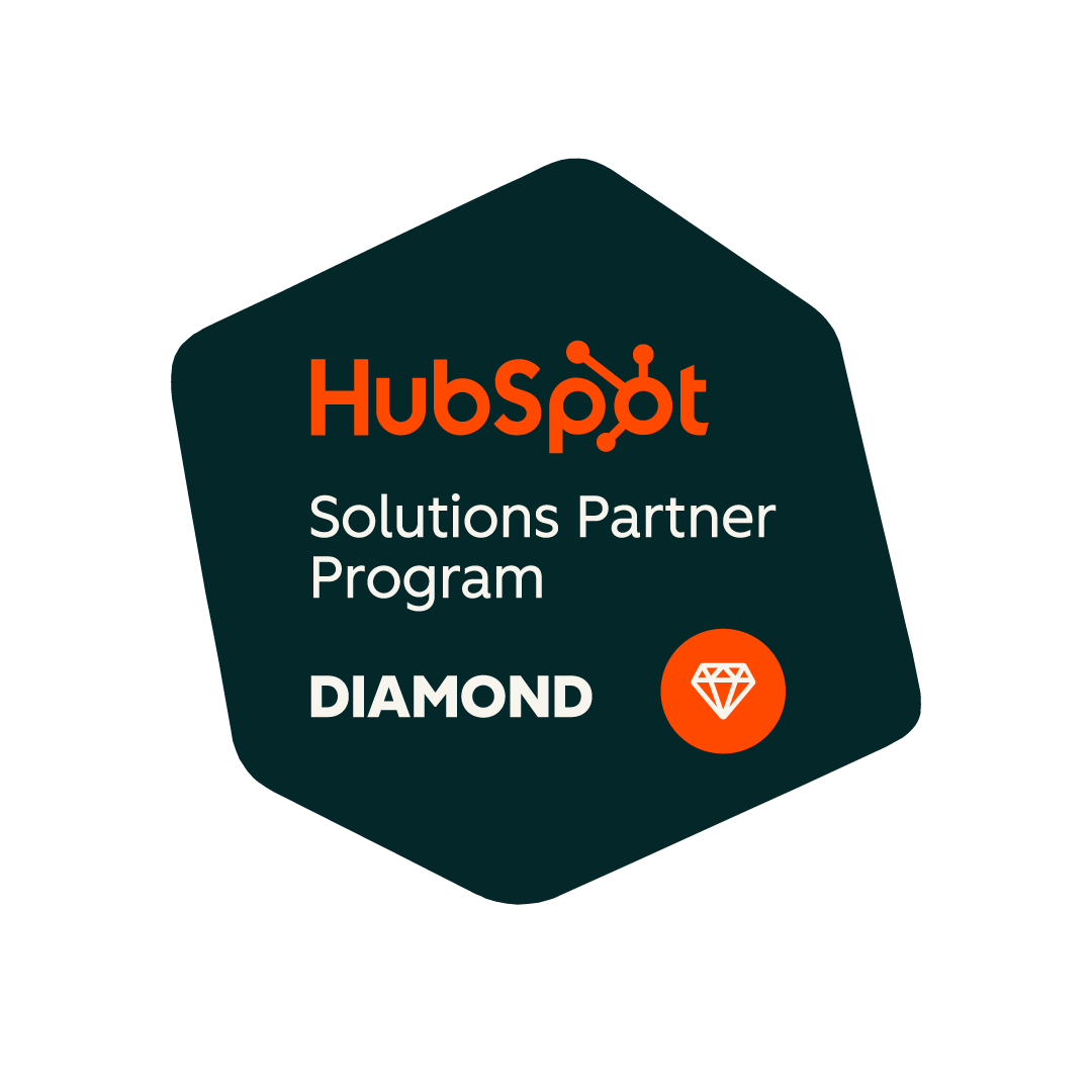 HubSpot Solutions Partner Program Diamond badge. Dark teal hexagon featuring the HubSpot logo, the words ‘Solutions Partner Program’ and ‘Diamond’, with an orange diamond icon